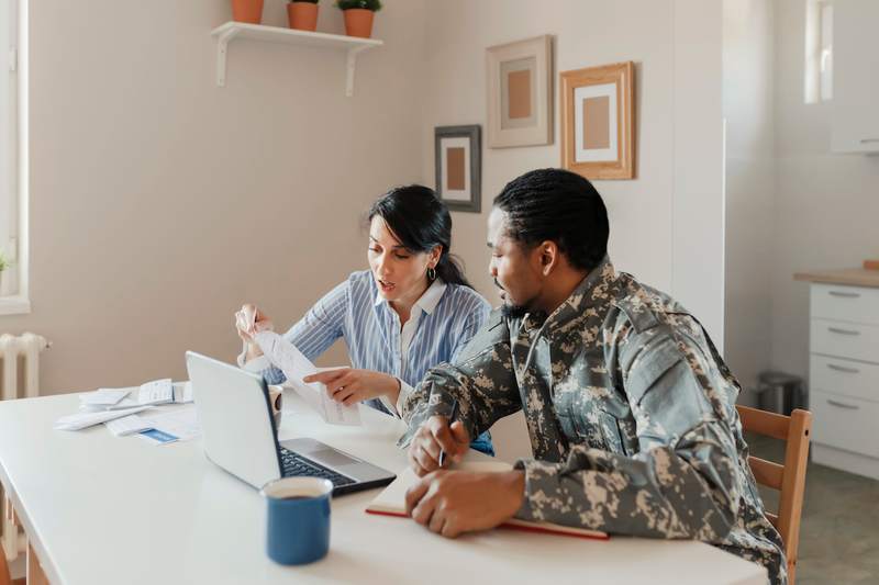 Soldier and wife discuss VA loan options.