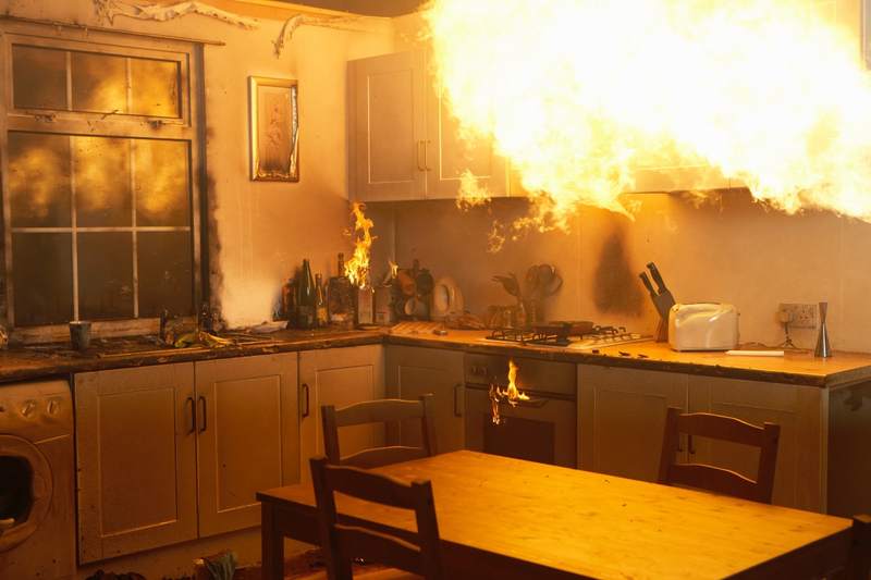 Kitchen fire spreads in a house with homeowners insurance.