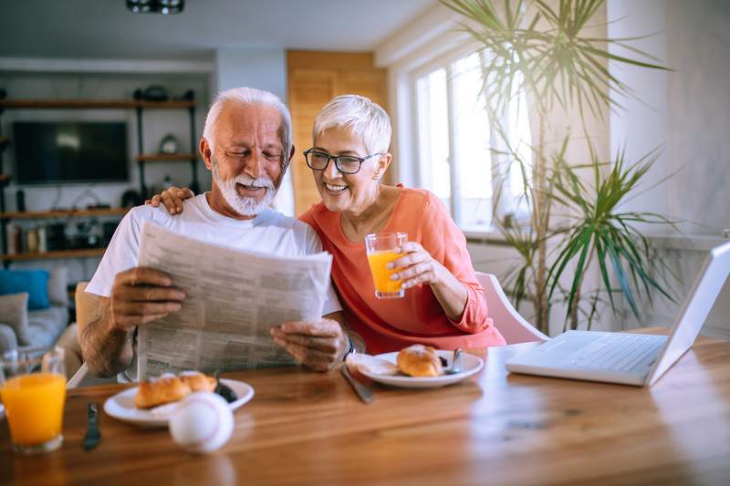 An older couple enjoys breakfast in their mother-in-law suite.